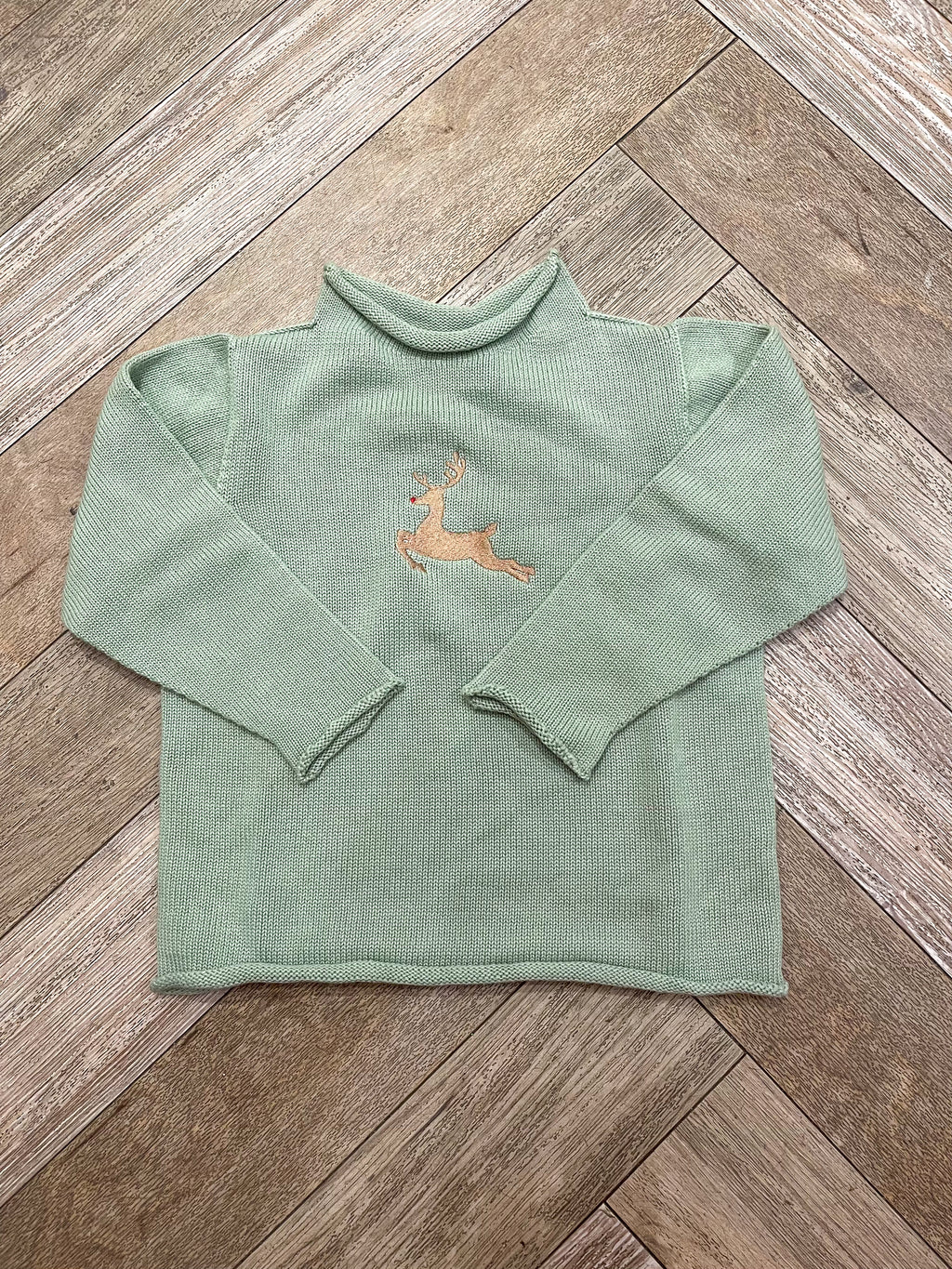 A Soft Idea Roll Neck Sweater in Sage with Reindeer